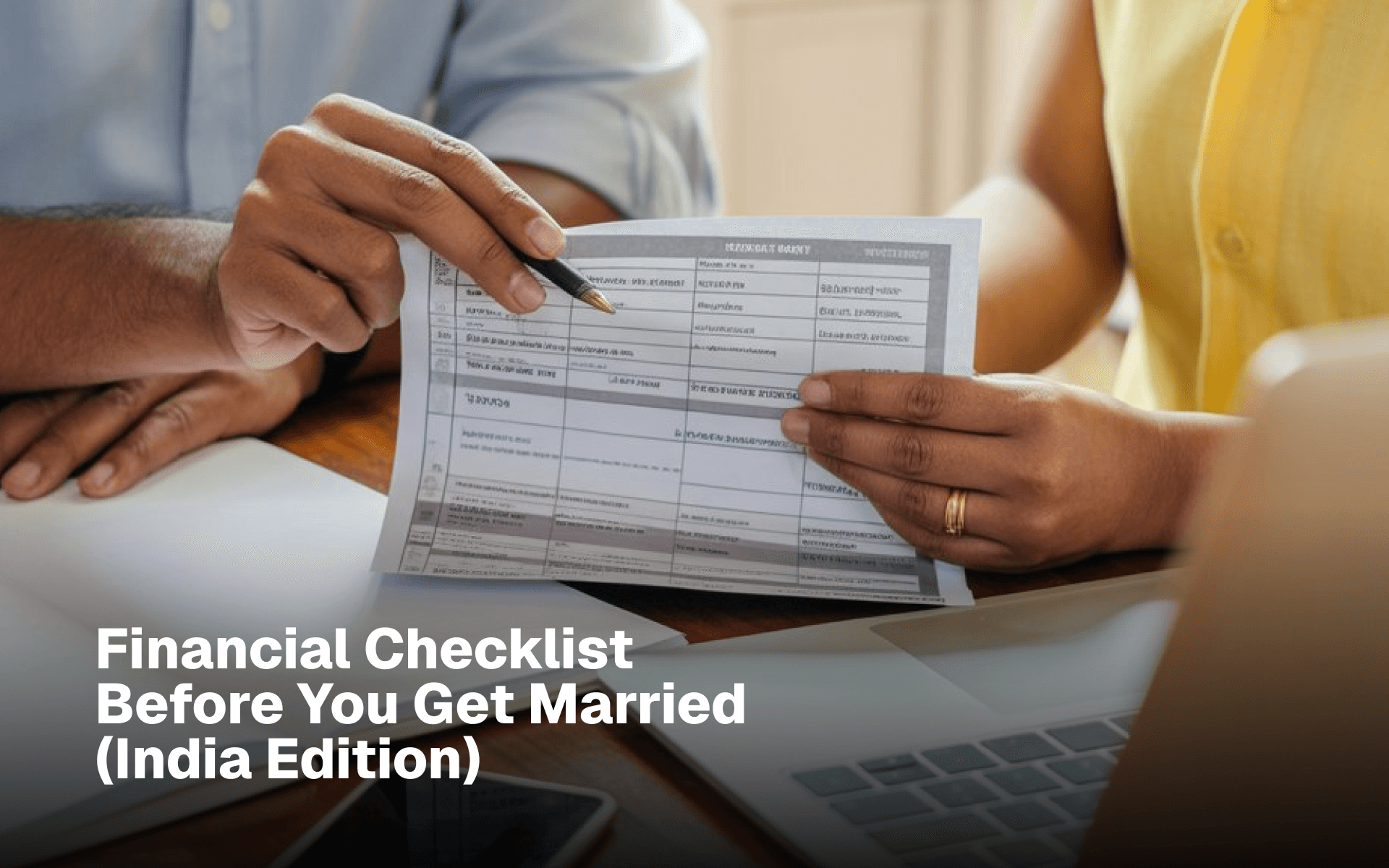 Couple reviewing a financial checklist before marriage