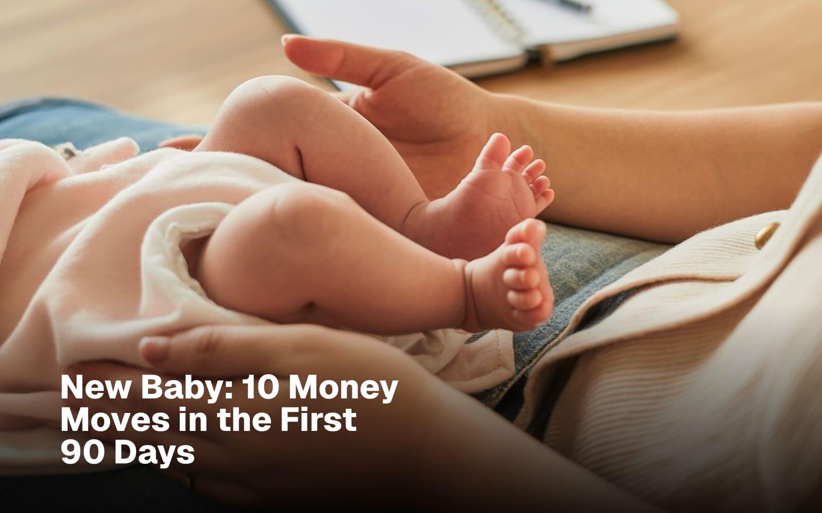 Newborn baby resting on a parent's lap beside a notebook of financial notes